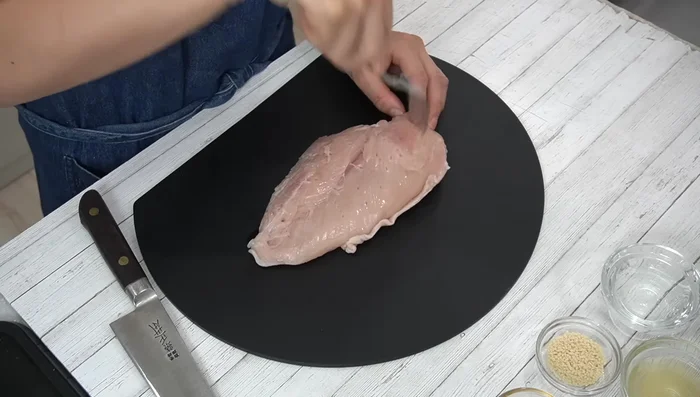 Poke holes all over the chicken breast with a fork to allow flavor penetration and make the meat tender.