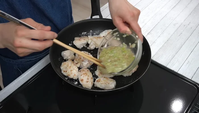 Pour the lemon sauce over the chicken and cook for about 1 minute, stirring to thicken the sauce.