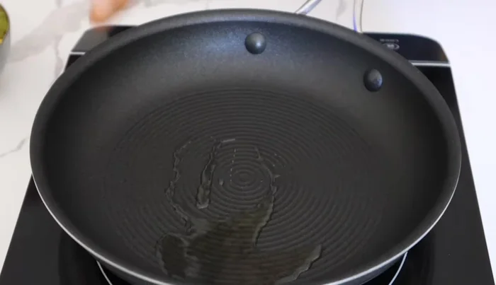 Heat oil in a frying pan over medium heat and cook the sausages until brown and cooked through.