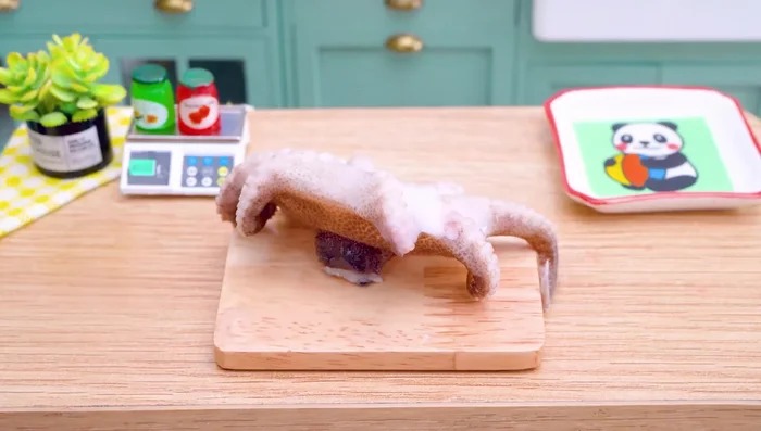 Slice the cooked octopus.