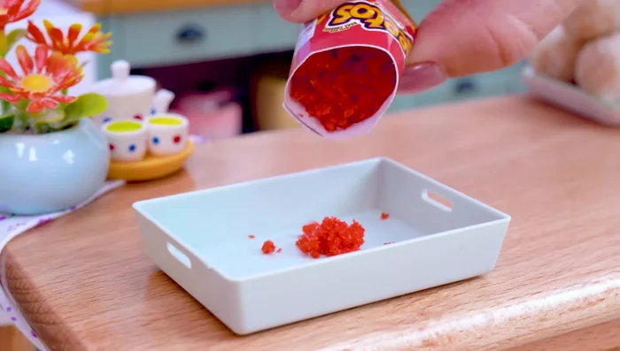 Mix crab leg meat, cheetos, flour, black pepper, chili powder, and salt. Fry the mixture.