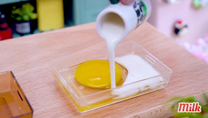 Prepare egg mixture with milk and flour, turmeric powder.