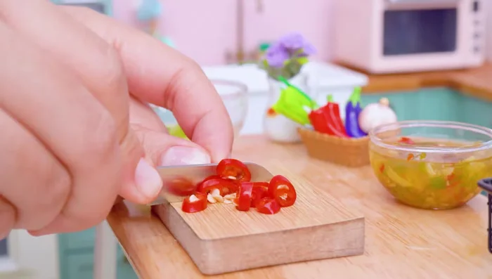 Prepare sauce with cucumber, corn pepper, carrot, onion, and parsley.