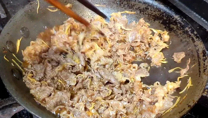 Once the sauce has thickened and coated the beef, remove from heat.