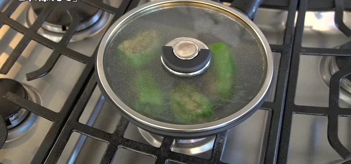 Continue steaming, turning the peppers until browned all over. Press down slightly at the end to enhance flavor penetration.