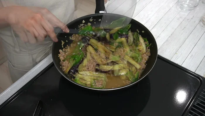Add the prepared miso mixture and stir well. Simmer for about 1 minute.