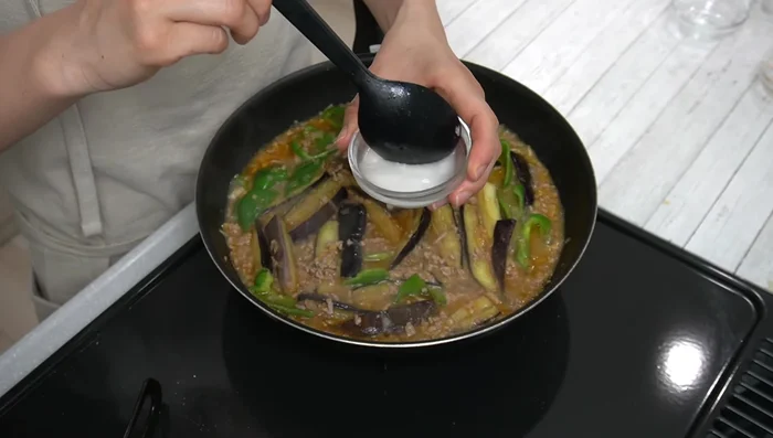 Stir in the watered potato starch quickly, mixing well to thicken the sauce. Cook for about 30 seconds until the starch is cooked through.