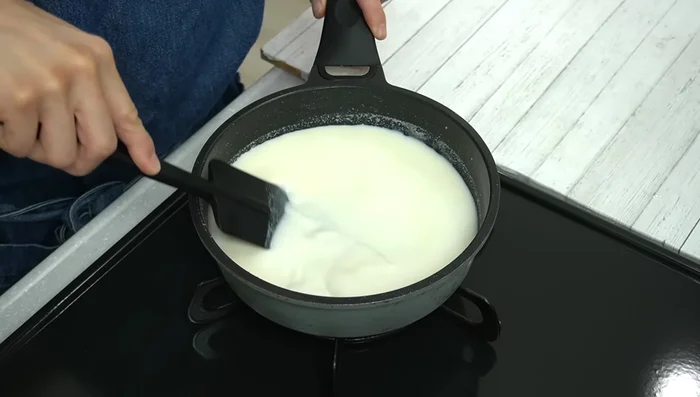 Heat the mixture on medium heat, stirring occasionally, until the surface bubbles slightly. Then, turn off the heat.