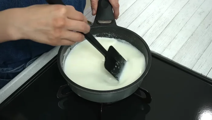 Add the slightly warmed fresh cream (to prevent gelatin particles from forming) and mix well. Strain the mixture for a smoother texture.