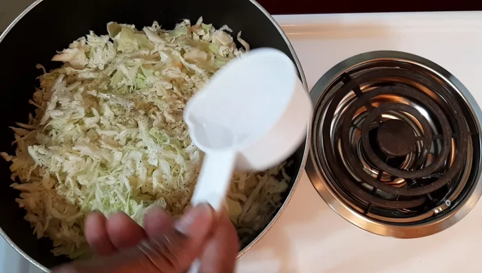 Add 2 tablespoons of water (adjust amount based on the quantity of cabbage). Stir well.