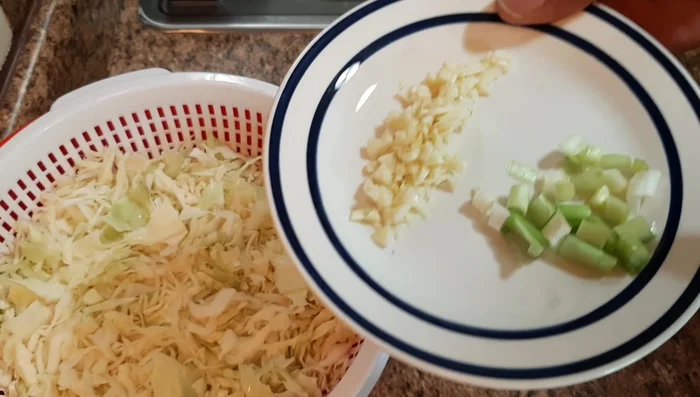 Chop two cloves of garlic. Garlic powder can be used as a substitute.