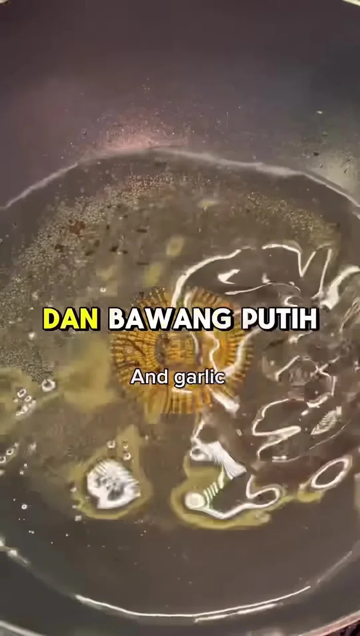 Heat oil in a frying pan over medium-high heat. (The transcript mentions frying, but not oil type or temperature)