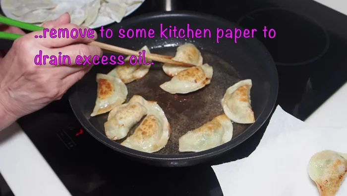 Drain the gyoza on kitchen paper to remove excess oil.