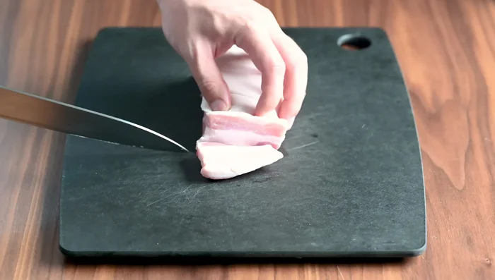 Prepare the pork: Cut 300g pork belly into 45mm thick slices. In a bowl, mix pork with salt, pepper, and potato starch.