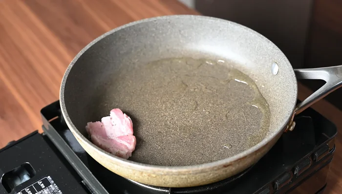 Cook the pork: Heat oil in a large frying pan. Add pork and brown on one side, then flip. Wipe away excess fat. Reduce heat to medium, pour caramel sauce around the pork, and cook until the sauce thickens and coats both sides evenly. Use a blowtorch for extra smoky flavor (optional).