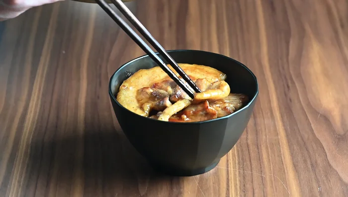 Assemble the Butadon: Serve hot Japanese short grain rice. Top with the glazed pork, leftover sauce, peas or edamame, and the prepared leek topping (shagane). Add benny sugar and shichimi togarashi (optional).