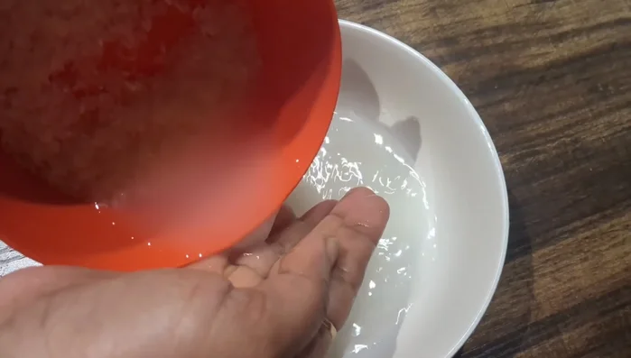 Rinse 4-5 generous spoons of raw white rice 2-3 times with clean water to remove impurities.
