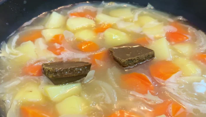 Add curry roux cubes (start with one or two, adjust to taste). Stir until dissolved and sauce thickens to desired consistency. Add more water to thin, or more roux for a thicker sauce.