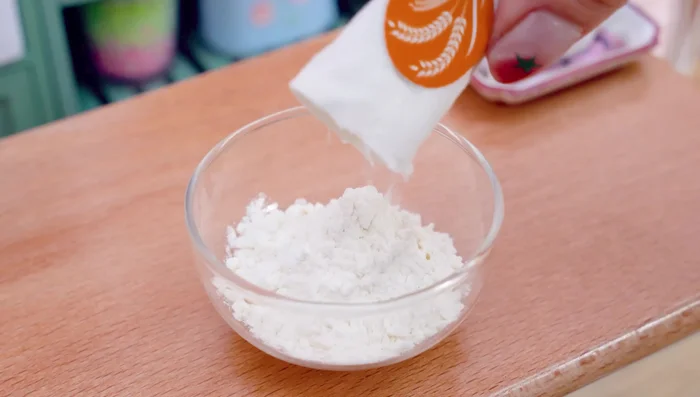 Make batter for octopus: mix flour, turmeric powder, chili powder and water.