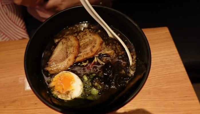 Prepare the pork. The video mentions using pork tendon, which adds a unique texture.