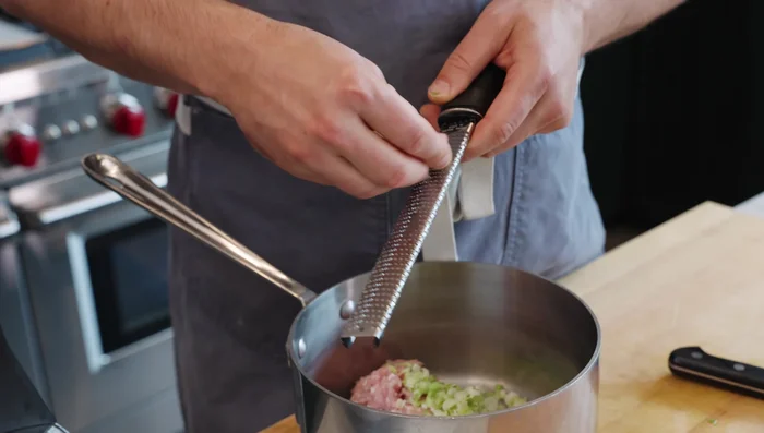 Grate garlic and ginger using a microplane (or finely chop).