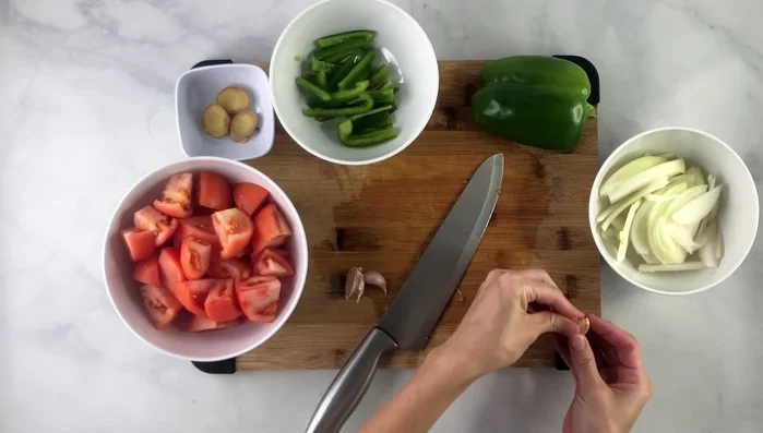 Prepare the garlic: Smash, peel, and mince using a garlic press.