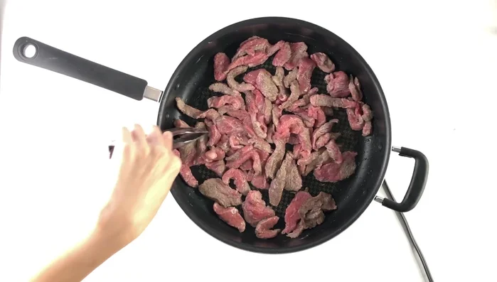 Remove beef from pan and set aside.