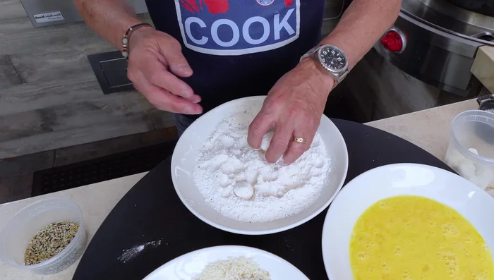 Dredge mozzarella balls in flour, then egg, then panko, repeating the egg and panko steps for a double coating.