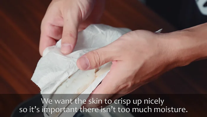 Remove mackerel from fridge and dry with kitchen paper again. Make shallow diagonal incisions across the skin to help prevent curling and allow salt to penetrate.