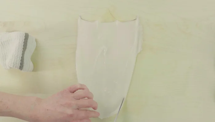 Trim the ends: Trim both ends of the squid with a knife to remove excess parts (118.84).