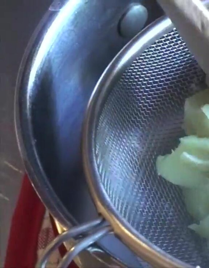 Strain the potatoes through a strainer while still hot.