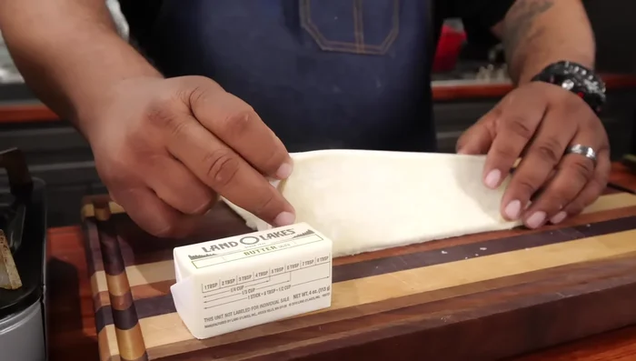 Roll out the puff pastry and cut into squares large enough for your desired apple pie size.