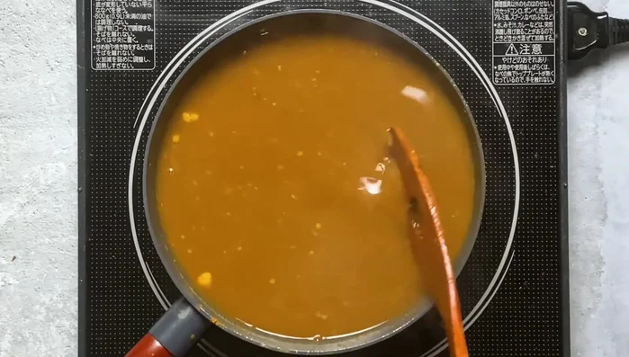 Simmer for two hours, stirring occasionally, until it reduces into a thick paste. Cool and refrigerate overnight.