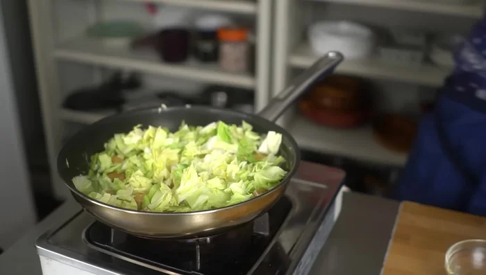 Add the chopped cabbage to the pan. Stir-fry until cabbage reaches desired tenderness (spring cabbage will soften quickly).