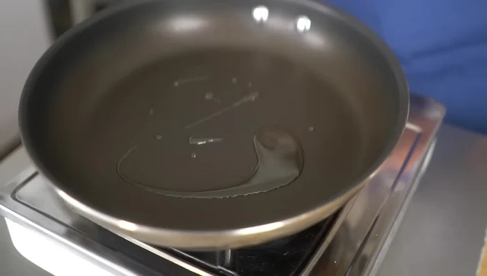 Heat 1 teaspoon of oil in a frying pan over medium heat.