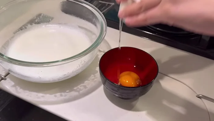 Crack one egg and add it in two batches, mixing well after each addition.
