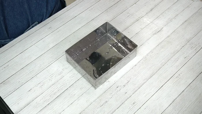 Remove from heat and pour into the prepared container. Smooth the surface.