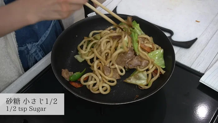 Add sugar, stir to combine. Then add dashi stock and Worcestershire sauce. Stir-fry thoroughly.