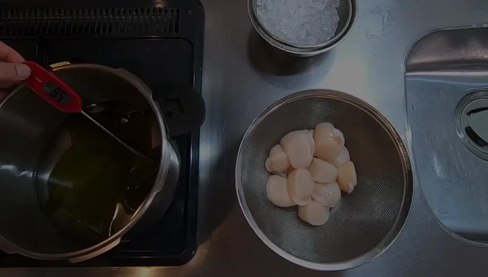 Remove the scallops from the saltwater and add them to the gently simmering kombu water. Poach for 15-20 minutes.