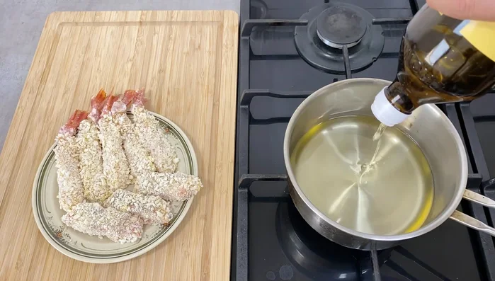 Heat frying oil to approximately 180°C (356°F). Fry the salmon for 2-3 minutes until golden brown. Fry the shrimp similarly.