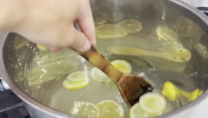 Warm the mixture gently to dissolve the sugar, then turn off the heat.