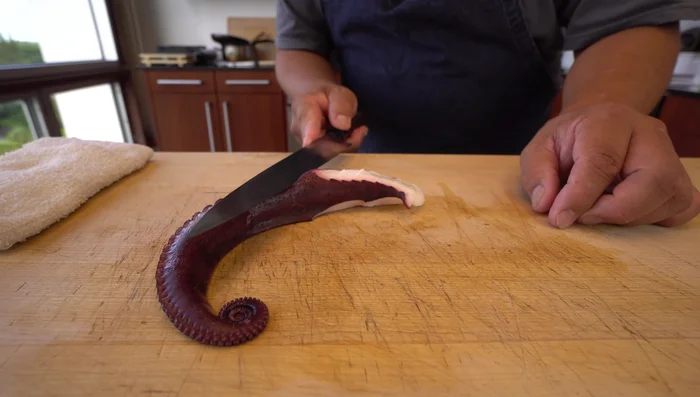 Prepare the octopus: Clean and cut the octopus into desired thickness and length. Consider the desired length and thickness of the octopus based on your preference. (82.439)