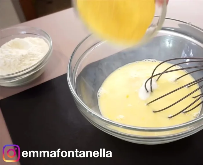 Whisk together milk and eggs. Add sugar, cornmeal, baking powder, and flour. Mix until just combined.