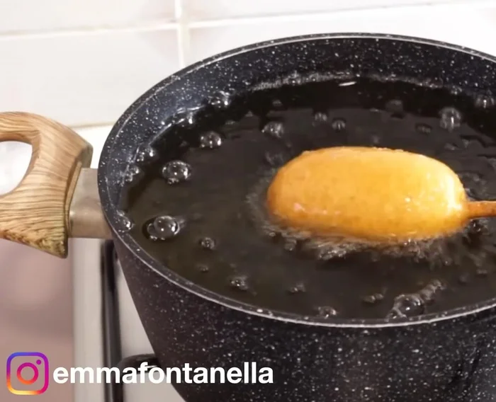 Heat oil to 160-180°C (320-350°F). Carefully fry chocolate dogs, swirling or submerging until golden brown.