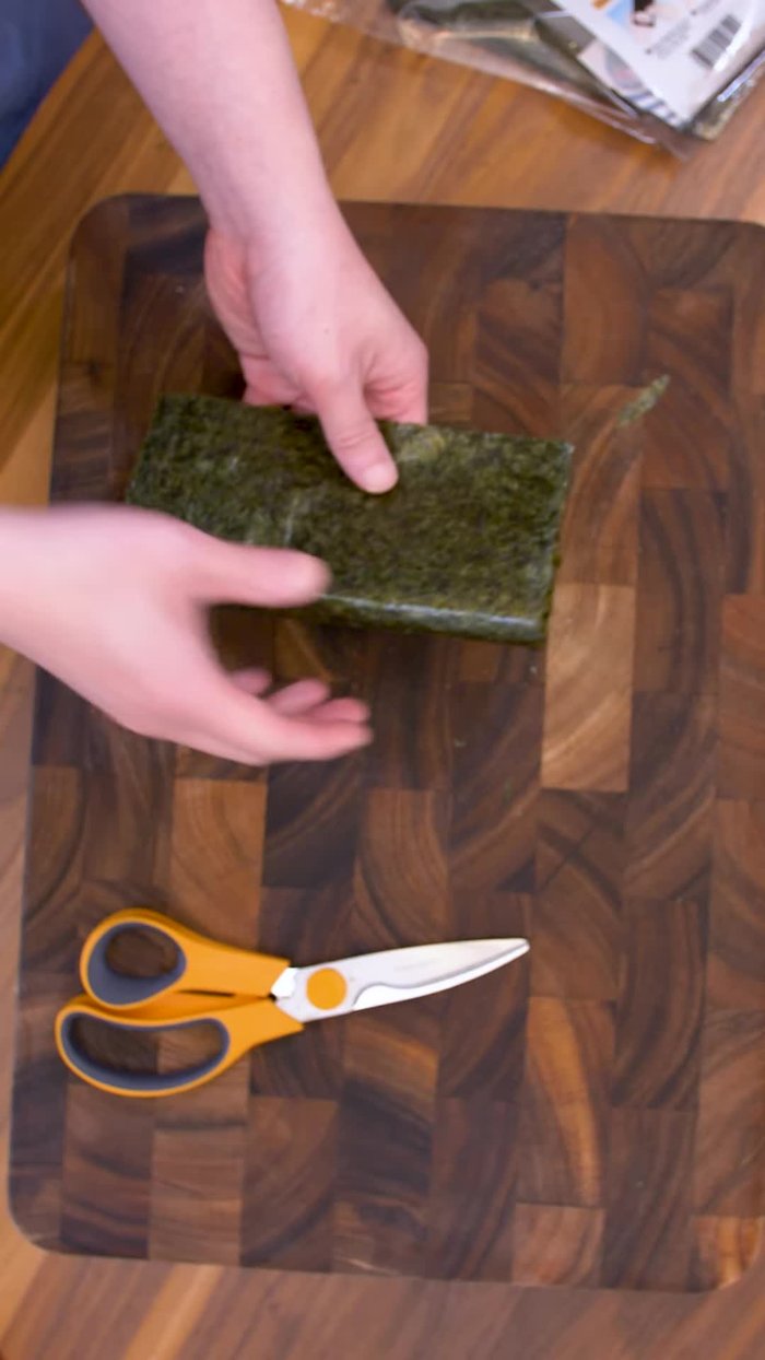 Prepare the Nori: Fold a nori sheet in half, then divide it into thirds.
