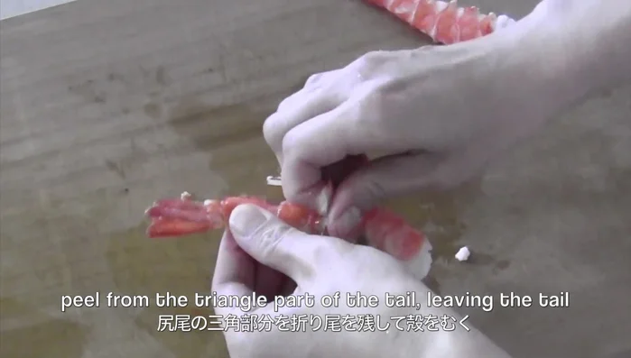 Prepare the shrimp for sushi: Once the shrimp is cool, peel from the triangle part of the tail, leaving the tail (120.93). Cut the stomach side to the back until you reach the vein, being careful not to cut all the way through (123.85). Carefully remove the bamboo skewer (137.2). Open the shrimp wide and remove any remaining vein (141.22).