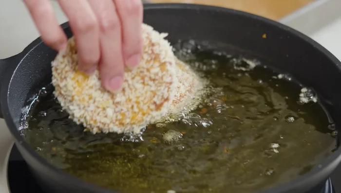 Deep fry the patties in hot oil until golden brown, turning once.