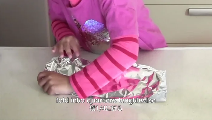 Cut aluminum foil and fold into quarters lengthwise to create rings for frying.