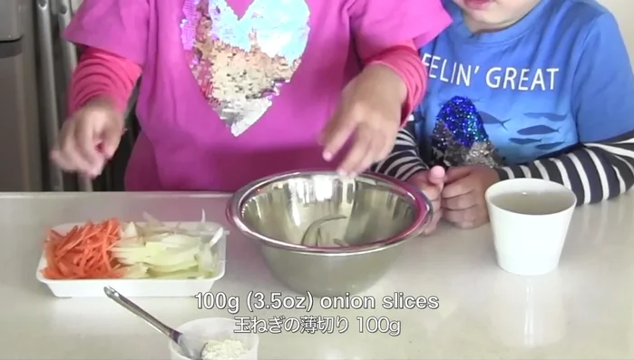 Prepare vegetables: slice onions, create carrot strips, and add corn.