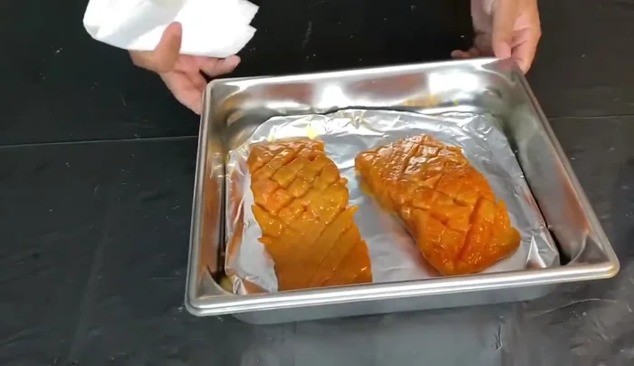 Broil the salmon: Place the salmon skin-side down on a baking sheet and broil on high heat for 7-10 minutes.